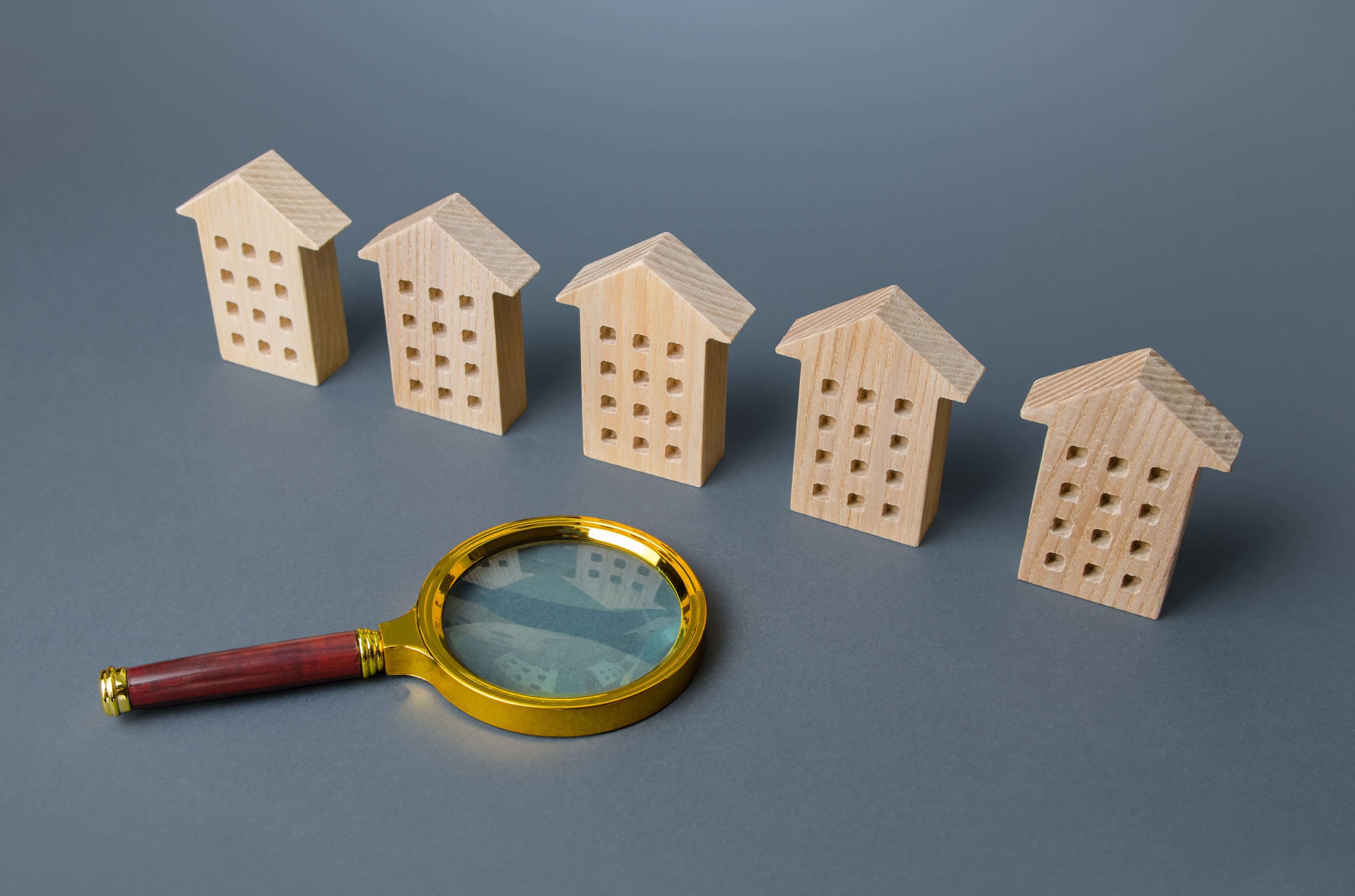 wooden houses next to magnifying glass